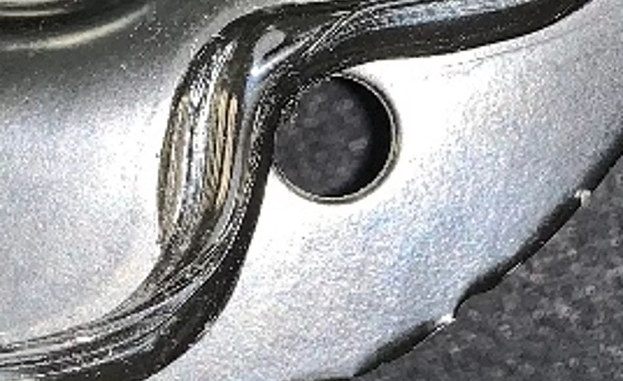 This adhesive bead was dispensed in the incorrect location, which could cause corrosion, water leakage, etc.