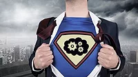 This image shows a businessman opening his suit to reveal a superhero emblem