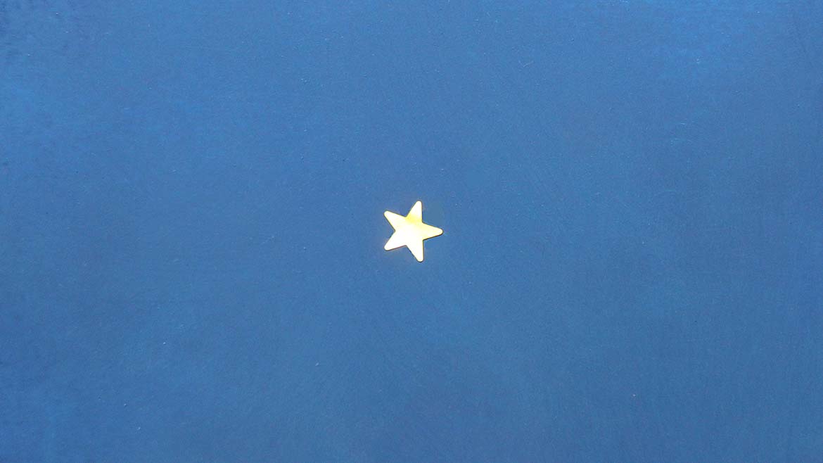 Gold star on a blue background