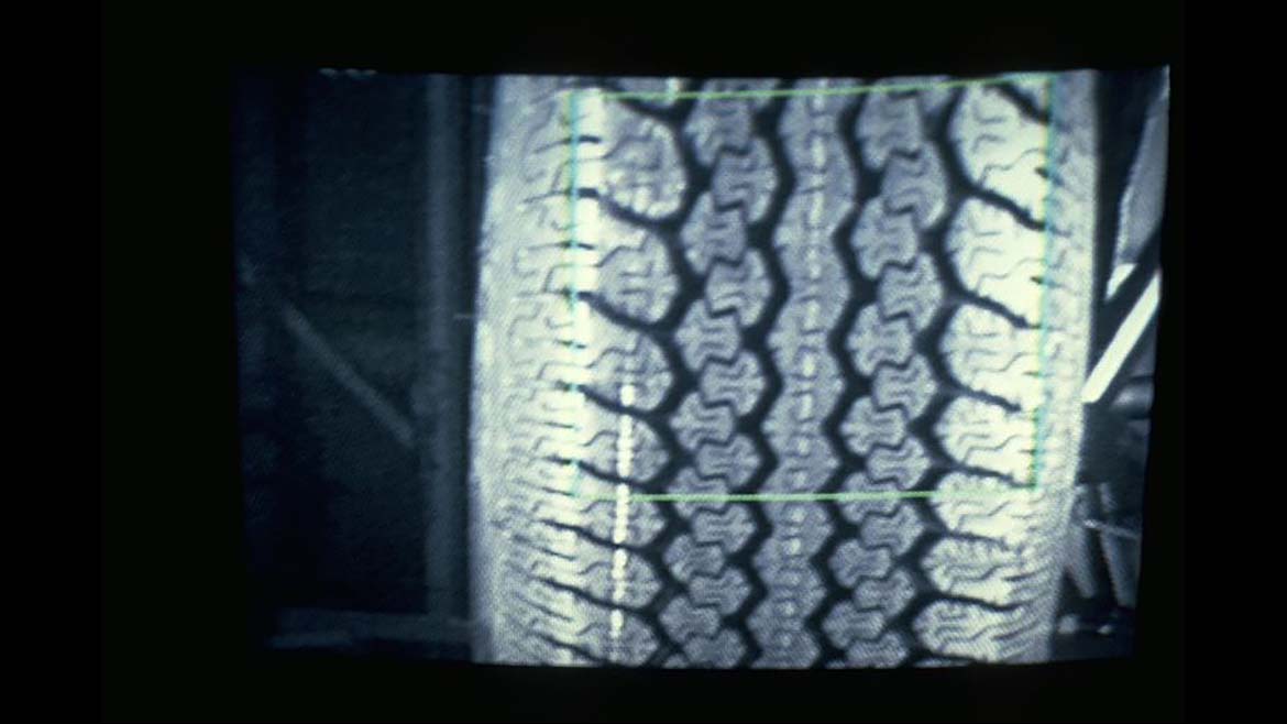Image of tire tread showing high-contrast tread pattern