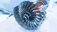 Aerospace Turbine Engine Component Manufacturing Close-up of a turbine rotor and compressor assembly used in an aircraft engine.
