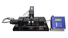 Rotating beam fatigue testing system with a motorized test fixture, specimen holder, and digital controller used for material fatigue and durability testing.