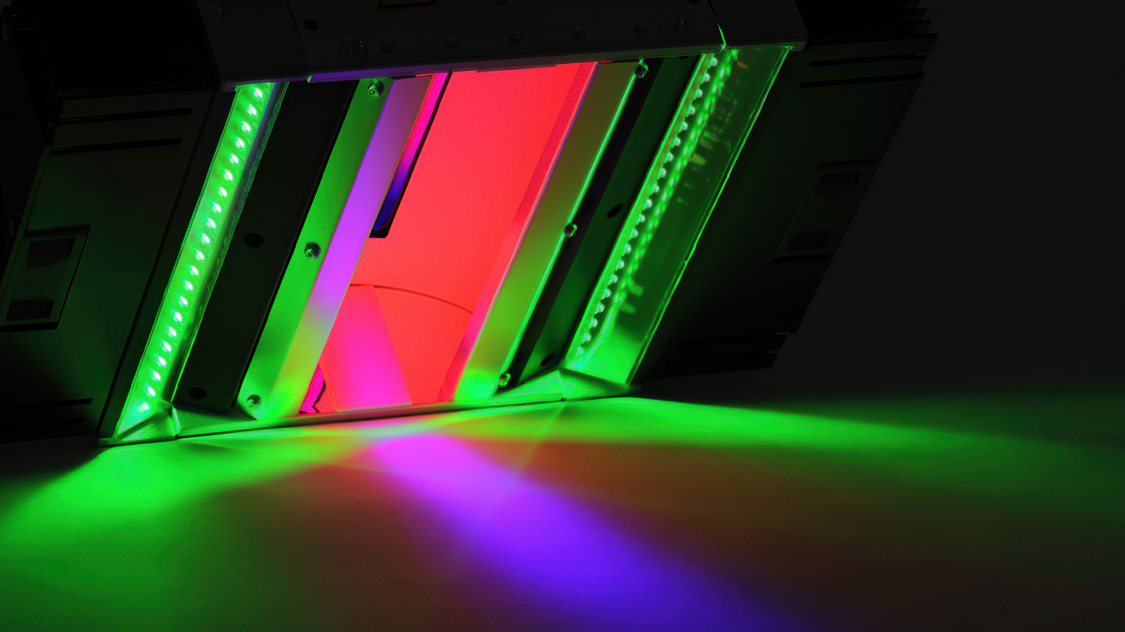 High-intensity LED line illuminator producing uniform lighting for line-scan camera inspection in industrial manufacturing environments.