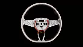 Industrial computed tomography (CT) scan of an automotive steering wheel, revealing internal wiring, electronic components, and structural features for nondestructive inspection and quality analysis.