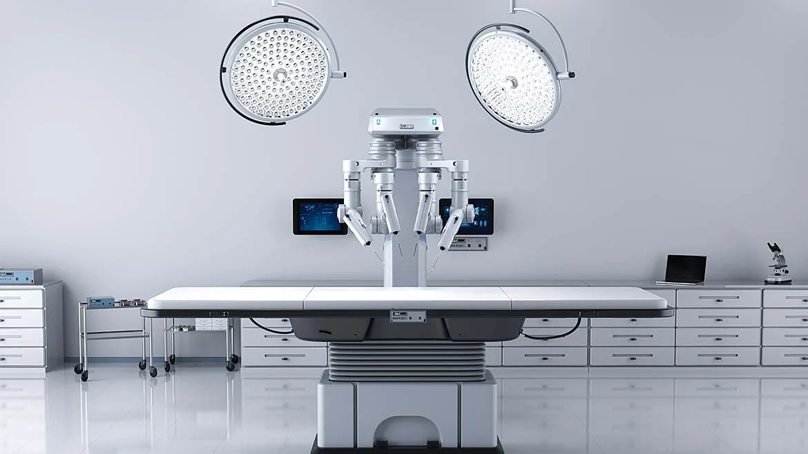 Robotic surgery system positioned over an operating table in a surgical suite.