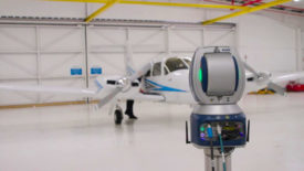 FARO Vantage Max 3D Laser Trackers being used in an airplane hangar.