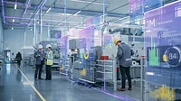 Workers in a factory with a virtual statistics overlay. Workers in a factory with a virtual statistics overlay.