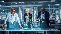 Industry 4.0 High-Tech Factory: Diverse Team of Robotics Engineers Working on Robot Arm Design Industry 4.0 High-Tech Factory: Diverse Team of Robotics Engineers Working on Robot Arm Design, Using Augmented Reality Hologram to Manipulate 3D Model by Gestures. Engineering with Digital Technology