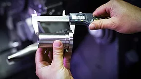 Worker measuring detail