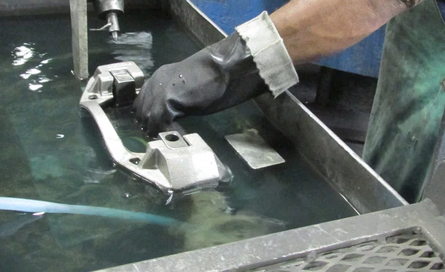 Figure 12: An operator manually loading a casting.
