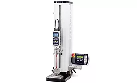 A force measurement testing machine is shown with a pair of wedge-action grips.