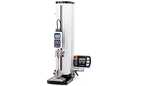 A force measurement testing machine is shown with a pair of wedge-action grips.