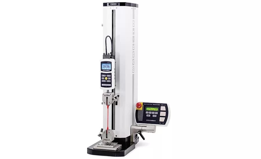 A force measurement testing machine is shown with a pair of wedge-action grips.