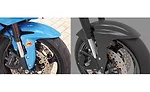 Original mudguard for a Honda CBR 600, and proposed carbon fiber after-market replacement.