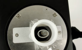 Metal sliver in sample cup, ready for handheld XRF analysis. Source: Bruker