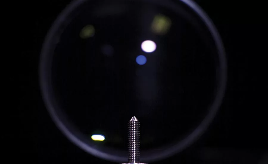A prototype vision station that captures images of a part.