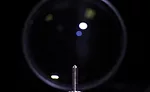 A prototype vision station that captures images of a part.