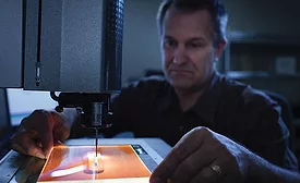 Dan Bukaty Jr. at the Starrett AV300 measuring a part.