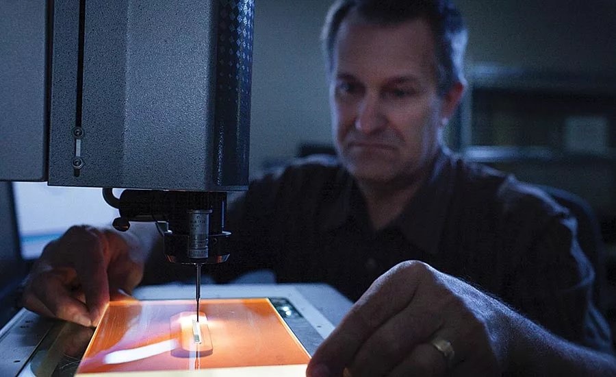 Dan Bukaty Jr. at the Starrett AV300 measuring a part.