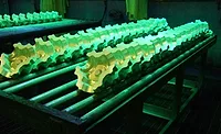 Aerospace parts undergoing fluorescent penetrant testing. Aerospace parts undergoing fluorescent penetrant testing.