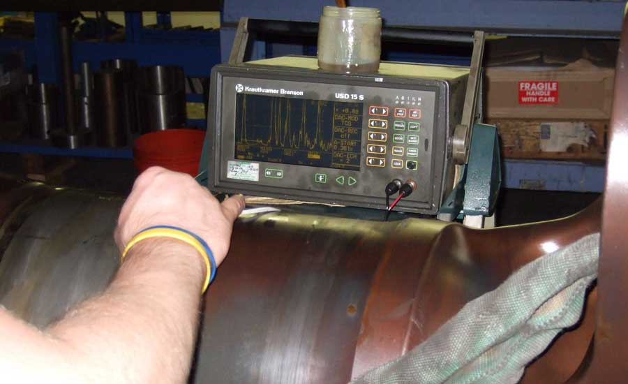 An ultrasonic machine testing a large aerospace part
