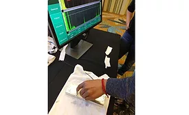 A student detecting a defect with ultrasonic testing.