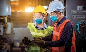 people in hard hats and face masks