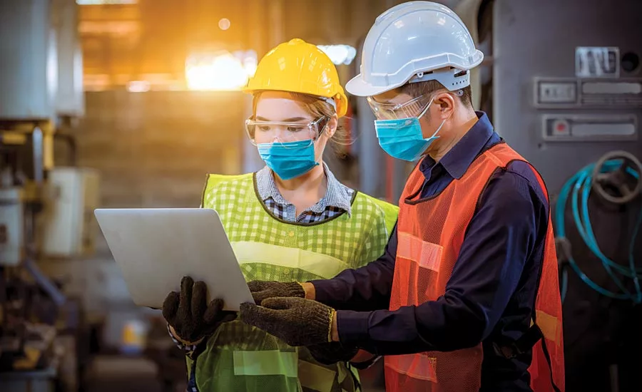 people in hard hats and face masks