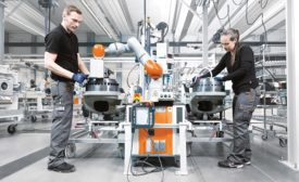 man and manufacturing robot