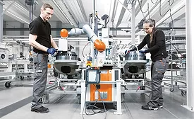 man and manufacturing robot