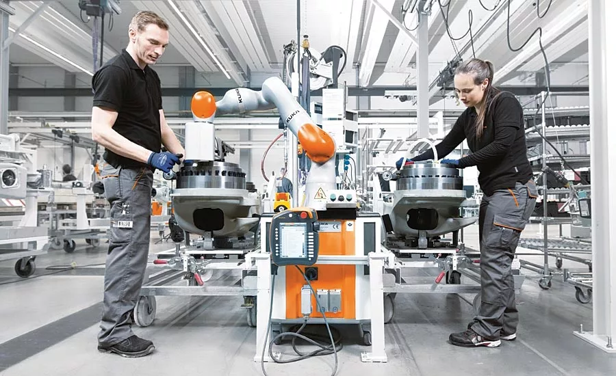man and manufacturing robot