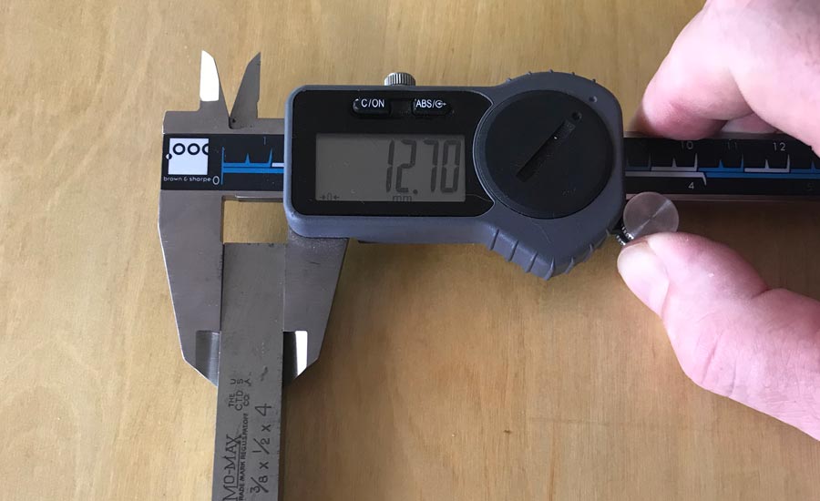 calipers measuring a cobalt square