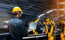 man working with robots