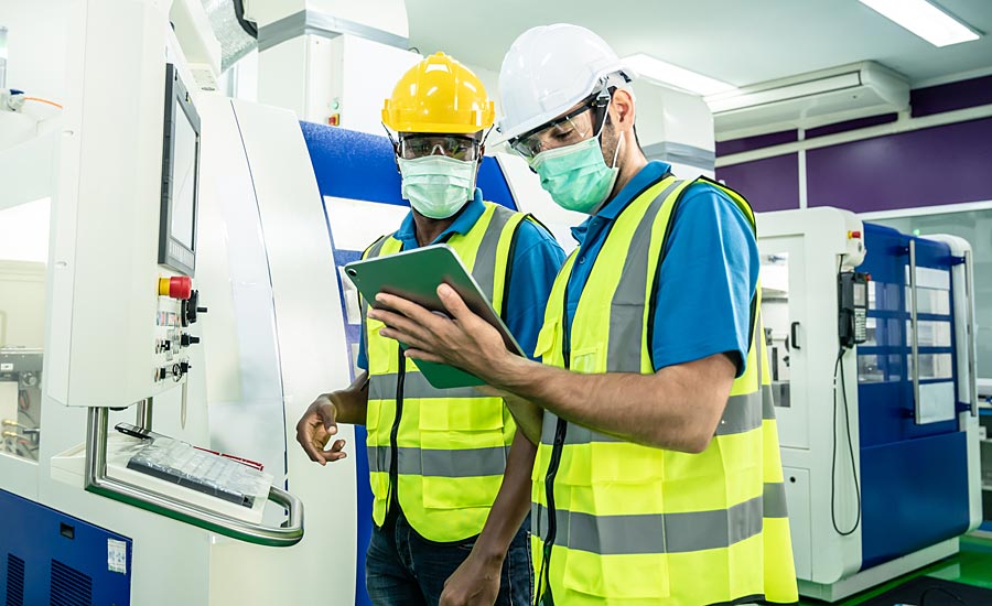 Two workers in masks.