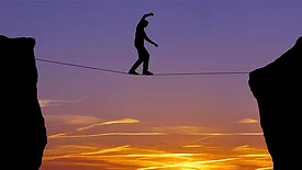 QM 1223 CLMN Lean with Lazarus. Image of tightrope walker with sunset.