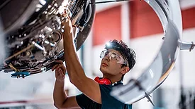 QM 1223 From the Editor Column feature image of worker in production line
