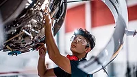 QM 1223 From the Editor Column feature image of worker in production line
