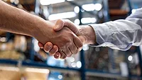 April 2024 Quality Dane Sanders column feature image of warehouse manager hiring an employee and handshaking his hand