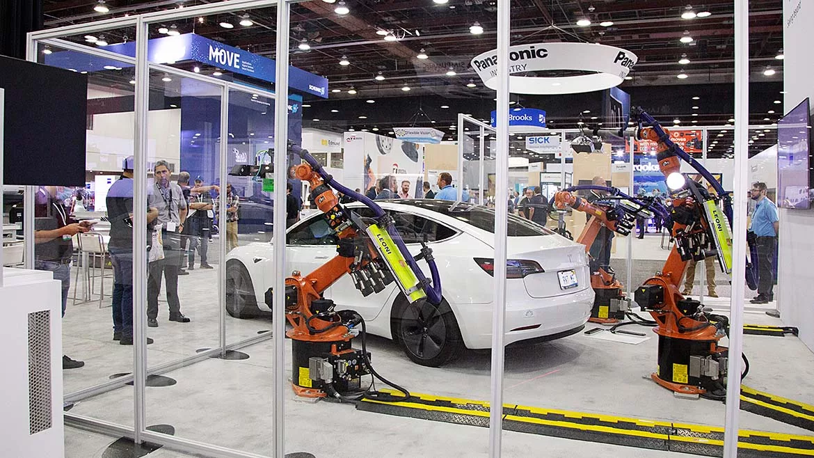 Automate event featuring automation demonstration using white vehicle.