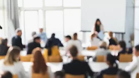 Business presentation background. Defocused image of people attending a lecture.
