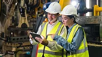 Project manager and engineer inspection A project manager and engineer inspecting work pieces and checking standards and safety for products and safety in the factory.