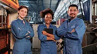 Three workers in a line-up and arms crossed together after work in a factory. Three workers in a line-up and arms crossed together after work in a factory.