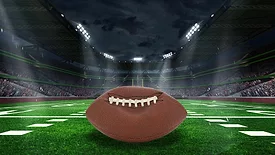 Unraveling Deflategate: Football stadium with closeup of football on field