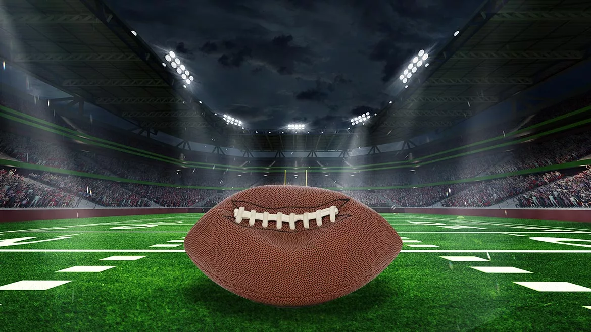 Unraveling Deflategate: Football stadium with closeup of football on field