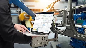 NDT Trends: Shifting left opening image of automotive manufacturing worker on laptop