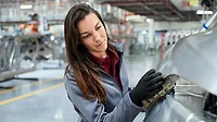 QM 0124 ASQ Speaking of Quality Column. Factory worker inspecting part.