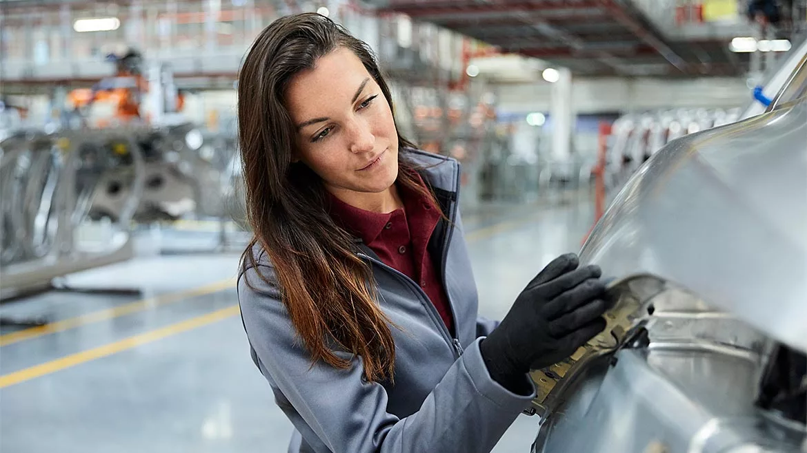 QM 0124 ASQ Speaking of Quality Column. Factory worker inspecting part.
