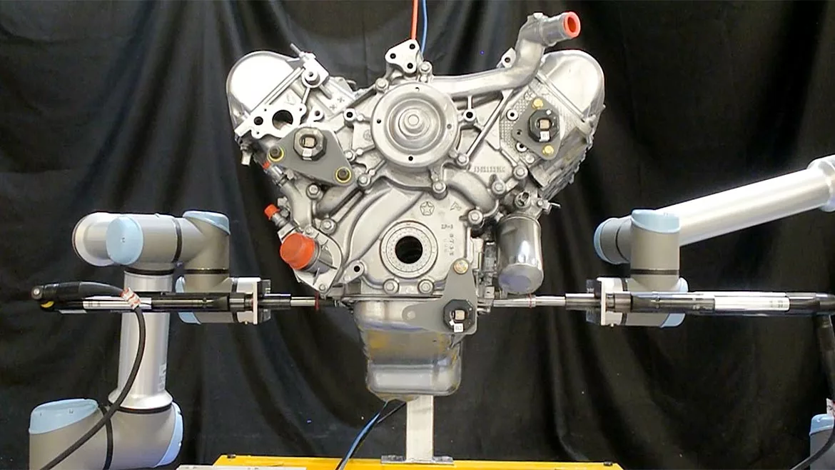 Machine Vision 101 feature. a pair of UR10e and UR16e cobots from Universal Robots perform assembly tasks on an engine that’s in motion –no machine vision required.