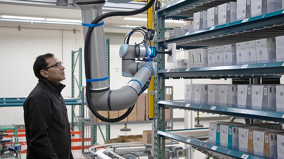 Machine Vision 101 feature. At DCL Logistics, a 3PL fulfillment center in California, the company has deployed a UR10e cobot equipped with a Datalogic vision camera. Once a product is picked, the SKU is verified by the camera.