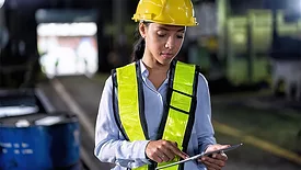 Software and Analysis B feature, female worker in hardhat